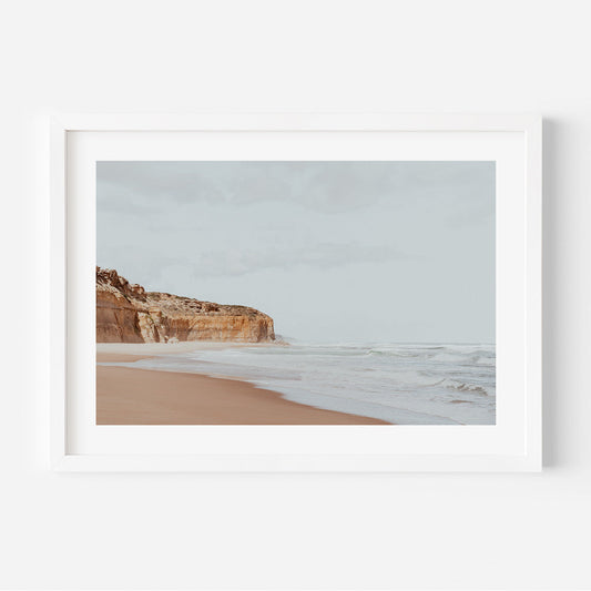 Serene Coastal Landscape with Cliffs and Gentle Waves in Soft Earth Tones