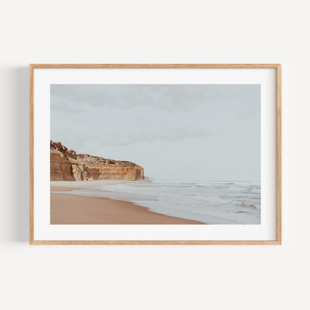 Serene Coastal Landscape with Cliffs and Gentle Waves in Soft Earth Tones