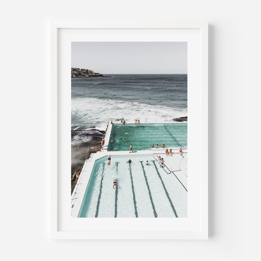 Serene Ocean Poolside Retreat with Bathers and Majestic Waves