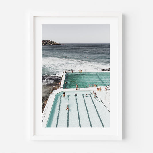 Serene Ocean Poolside Retreat with Bathers and Majestic Waves