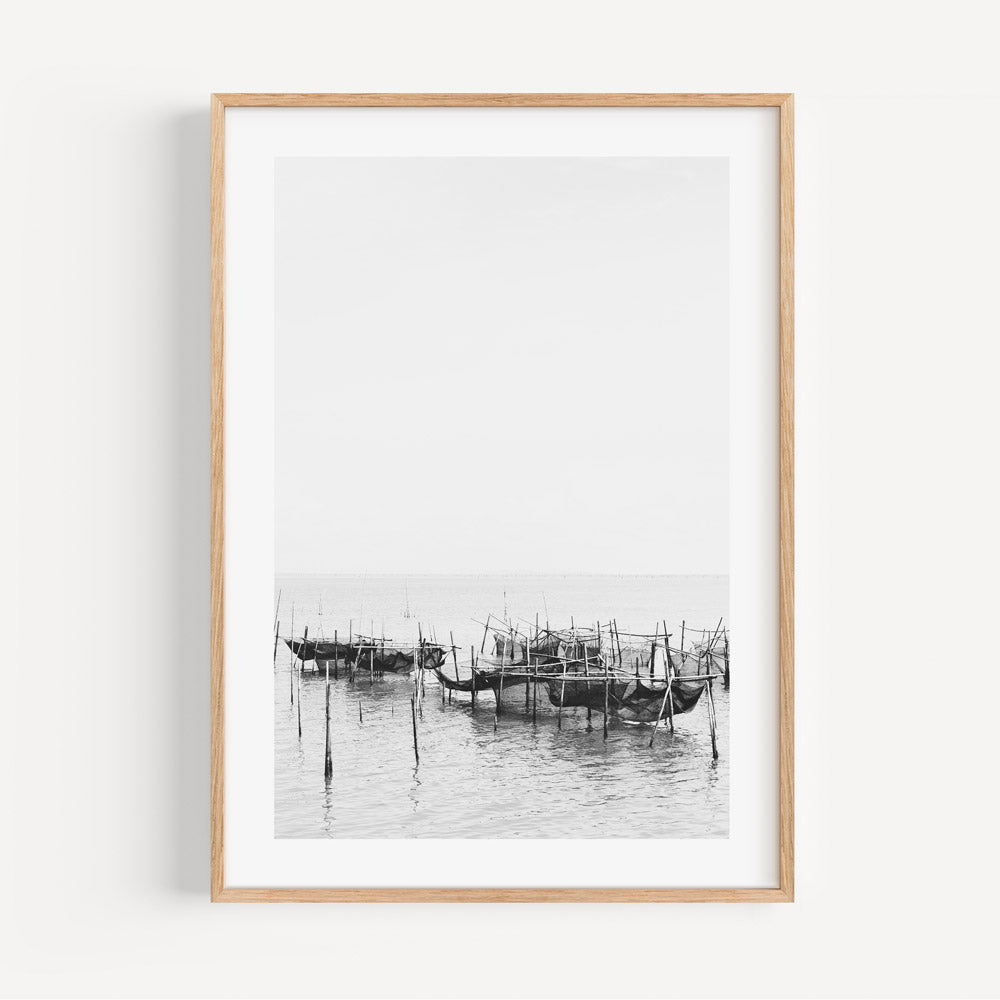 Serene Black and White Oil Painting of Traditional Fishing Boats in Still Waters