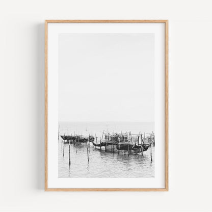 Serene Black and White Oil Painting of Traditional Fishing Boats in Still Waters
