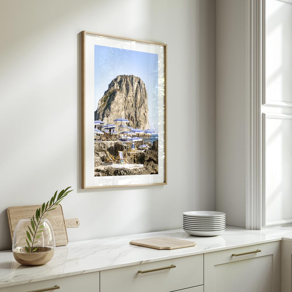 Serene Coastal Escape with Umbrellas and Rocky Cliff in Tranquil Seascape