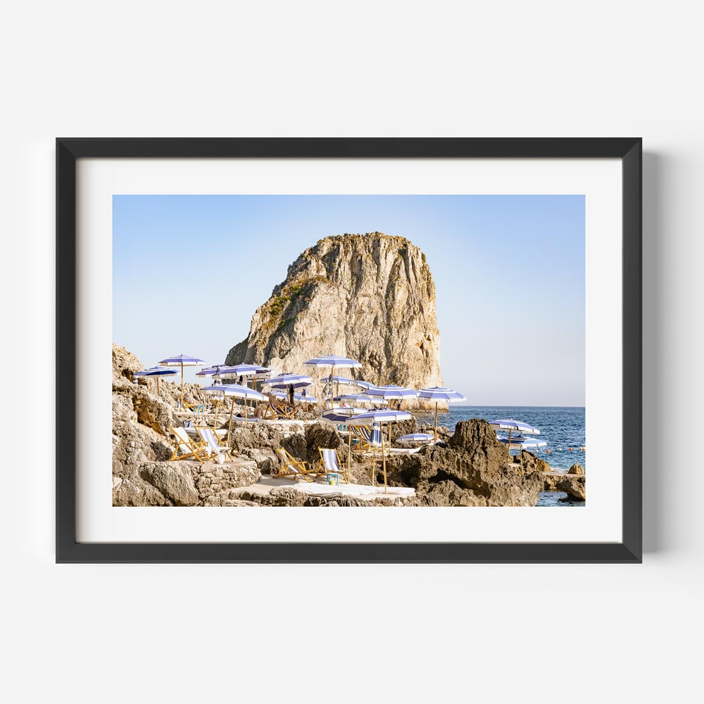 Serene Coastal Escape: Majestic Rock and Beach Loungers Oil Painting