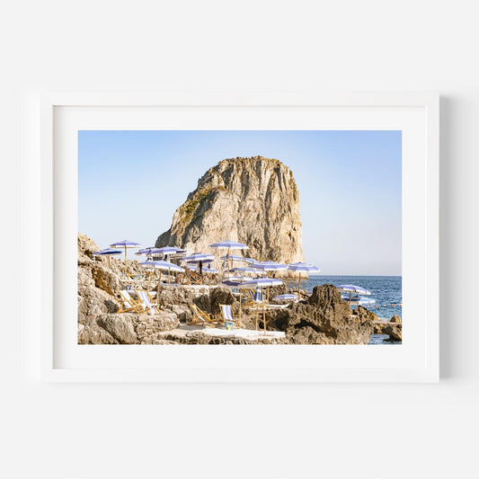 Serene Coastal Escape: Majestic Rock and Beach Loungers Oil Painting