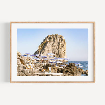 Serene Coastal Escape: Majestic Rock and Beach Loungers Oil Painting