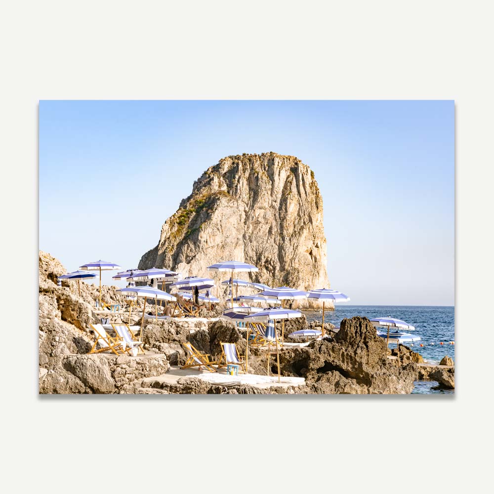Serene Coastal Escape: Majestic Rock and Beach Loungers Oil Painting