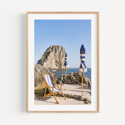 Charming Coastal Retreat: Serene Beach Scene with Umbrellas and Rock Formation