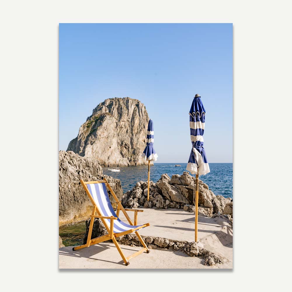 Charming Coastal Retreat: Serene Beach Scene with Umbrellas and Rock Formation