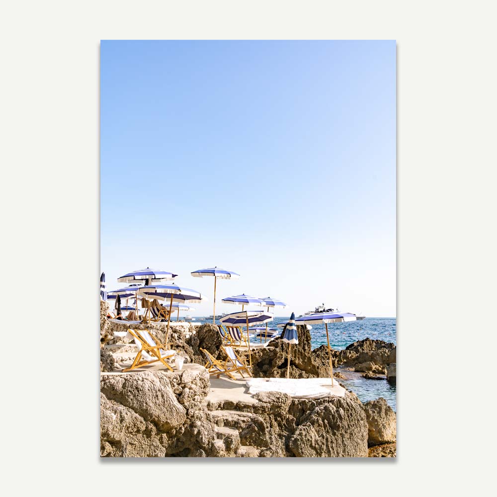 Serene Coastal Escape with Umbrellas and Rock Formations