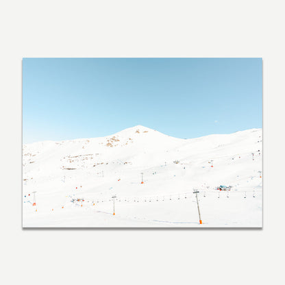 Serene Winter Landscape with Ski Lifts and Snow-Covered Mountains