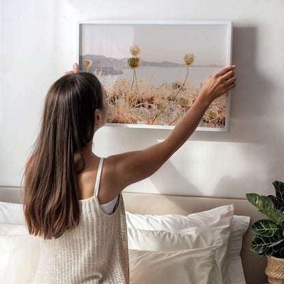 Serene Coastal Landscape with Wildflowers and Soft Sunset Hues