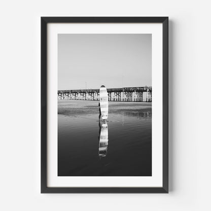 Black and White Longboard Surfer Reflection at Ocean Pier Sunset
