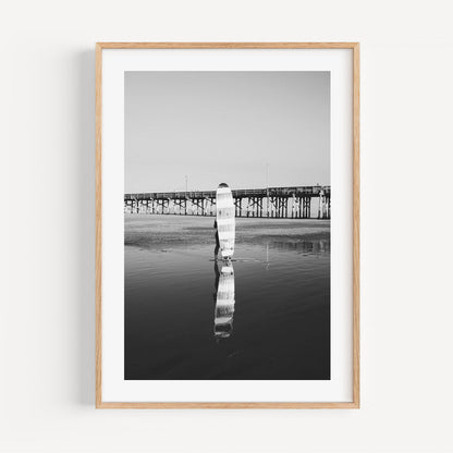 Black and White Longboard Surfer Reflection at Ocean Pier Sunset