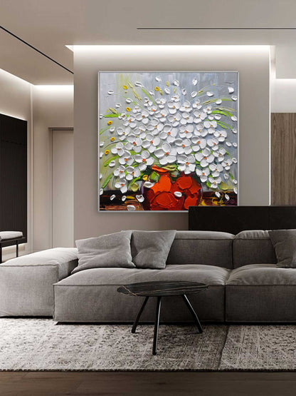 Vibrant Floral Still Life with White Flowers in a Bold Orange Vase