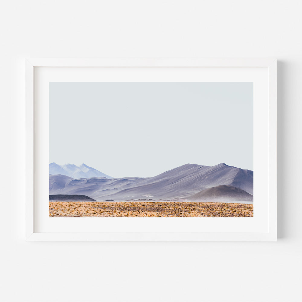 Serene Red Stone Landscape with Majestic Mountains and Tranquil Vista