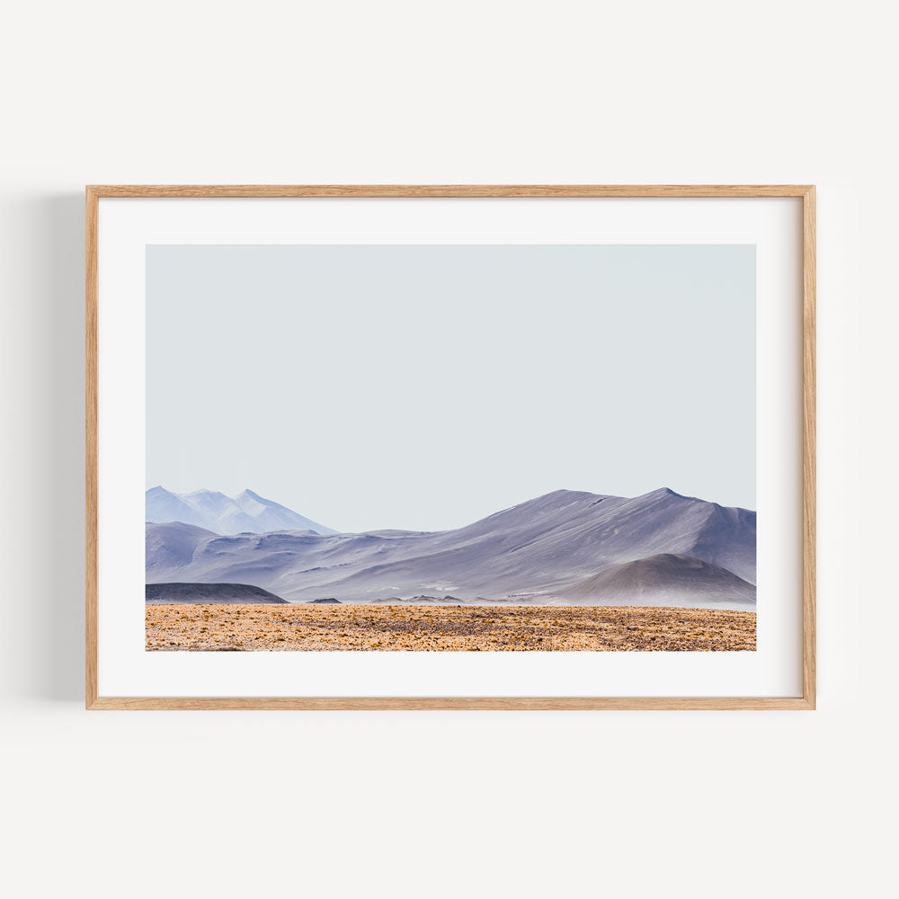 Serene Red Stone Landscape with Majestic Mountains and Tranquil Vista