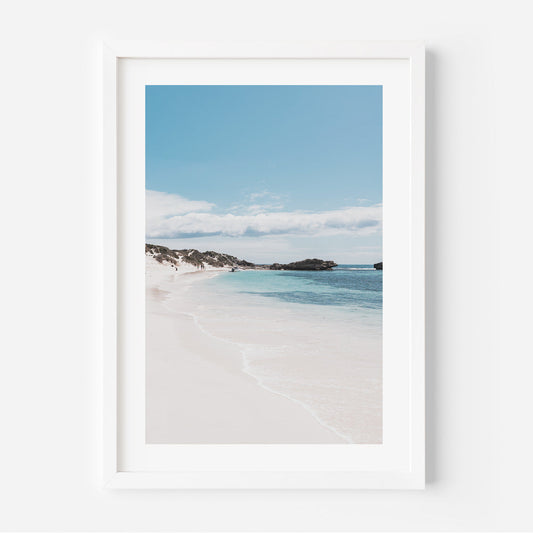Tranquil Beachscape with Blue Waters and Serene Sky