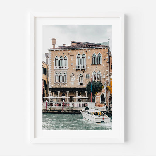 Charming Venetian Waterfront with Boat and Historic Architecture