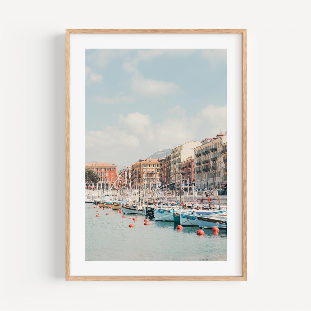 Serene Port Lympia Coastal Scene with Colorful Boats and Charming Waterfront