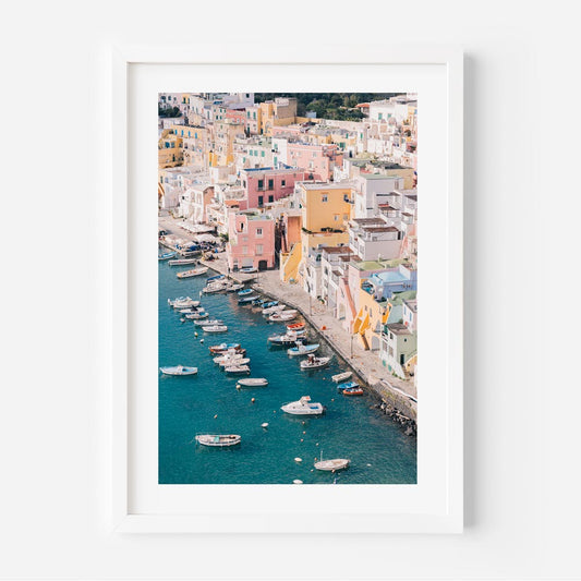 Vibrant Coastal Scene of Procida with Colorful Houses and Boats on Blue Water