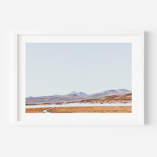 Tranquil Rocky Landscape with Meandering Path and Majestic Mountains