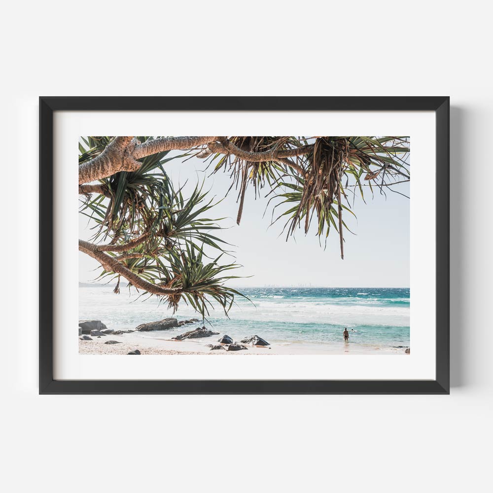 Tranquil Coastal Scene with Tropical Trees and Serene Ocean Waves