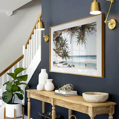 Tranquil Coastal Scene with Tropical Trees and Serene Ocean Waves
