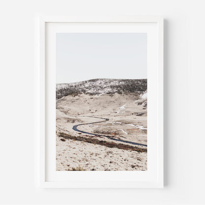 Serene Winter Landscape with Snow-Capped Mountains and Tranquil River