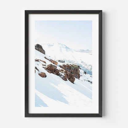 Serene Snowy Mountain Landscape with Majestic Rocky Outcrops