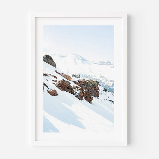 Serene Snowy Mountain Landscape with Majestic Rocky Outcrops