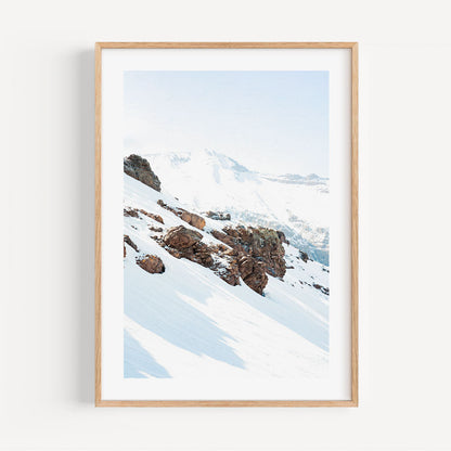 Serene Snowy Mountain Landscape with Majestic Rocky Outcrops