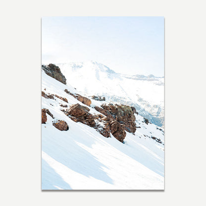 Serene Snowy Mountain Landscape with Majestic Rocky Outcrops