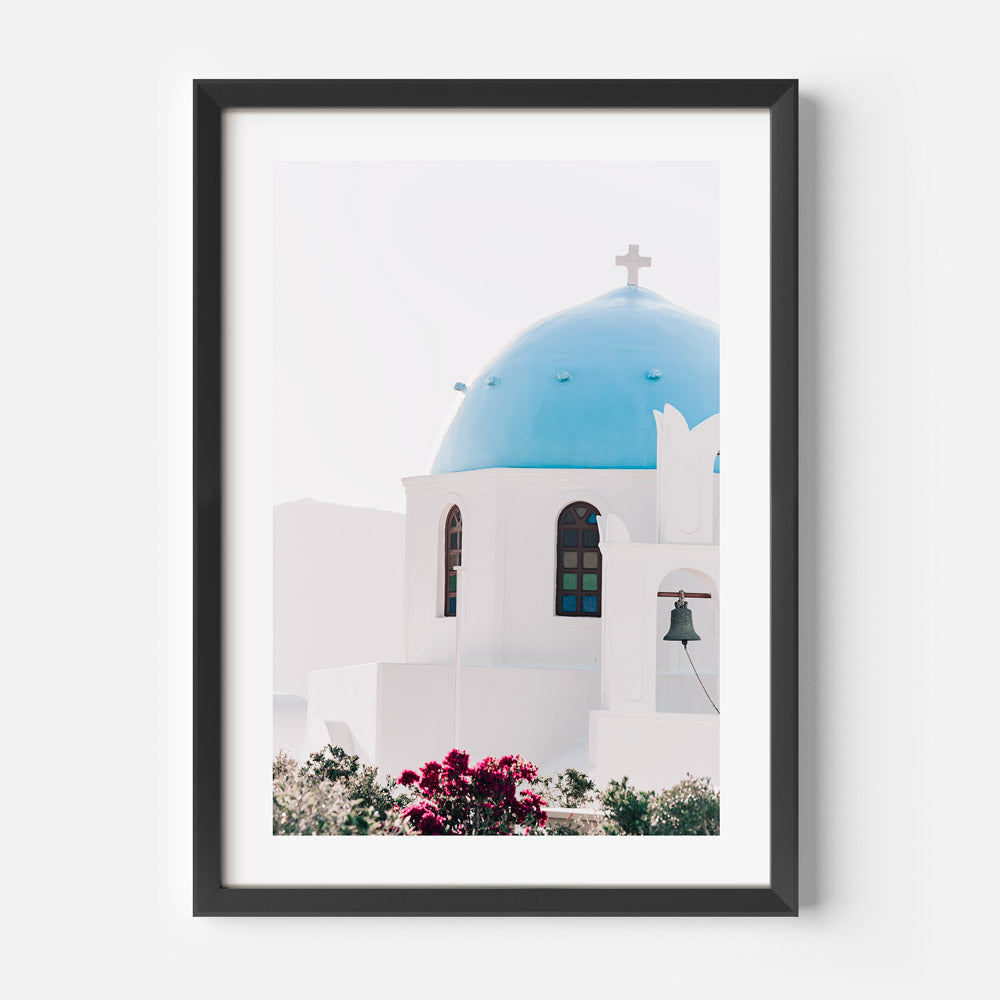 Serene Mediterranean Church with Blue Dome and Vibrant Flowers