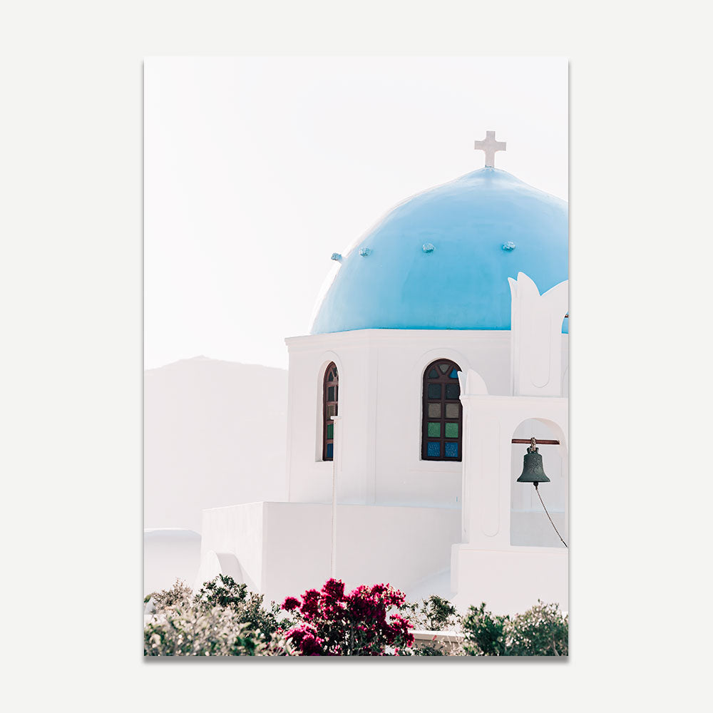 Serene Mediterranean Church with Blue Dome and Vibrant Flowers