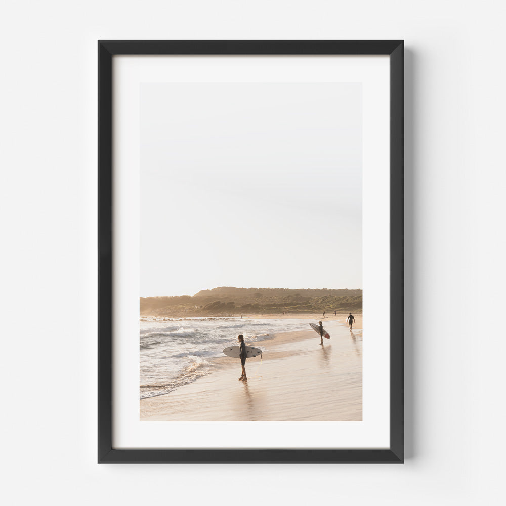 Tranquil Beach Scene with Surfers Embracing the Ocean's Rhythm