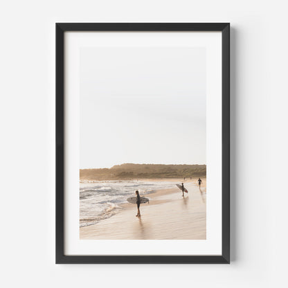 Tranquil Beach Scene with Surfers Embracing the Ocean's Rhythm