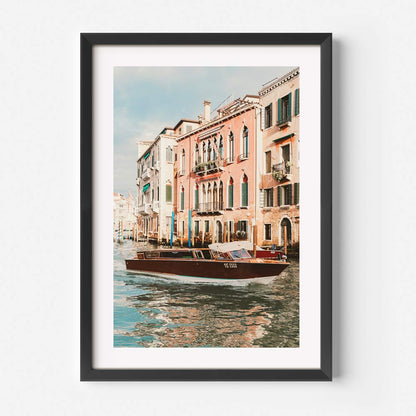 Venetian Waterway Serenity: Charming Boat on Canals with Historic Buildings
