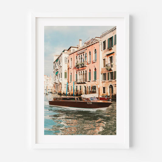 Venetian Waterway Serenity: Charming Boat on Canals with Historic Buildings