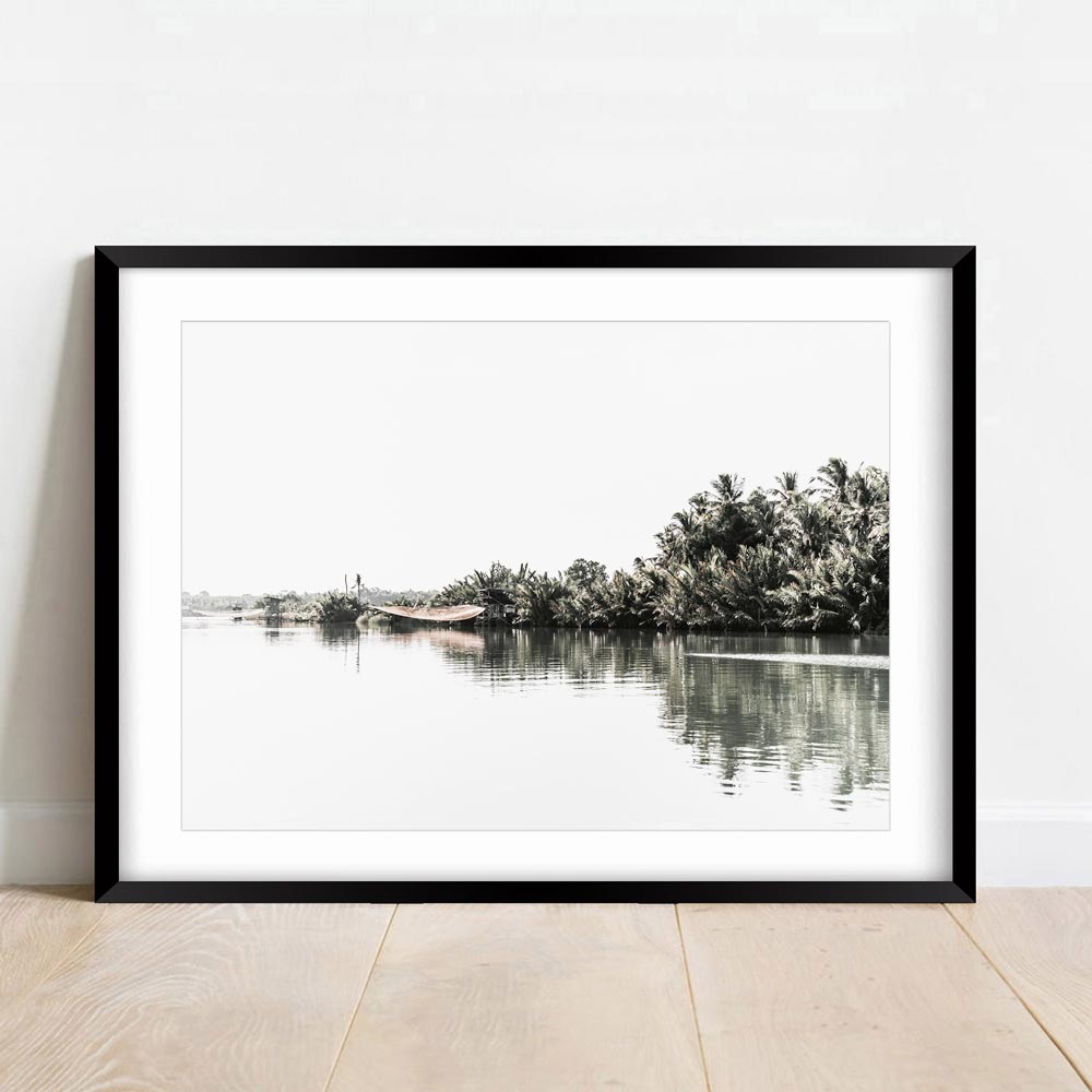 Tranquil Riverbank Landscape with Lush Palm Trees and Serene Waters