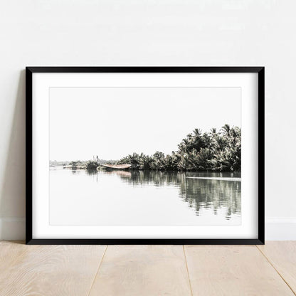 Tranquil Riverbank Landscape with Lush Palm Trees and Serene Waters