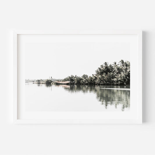 Tranquil Riverbank Landscape with Lush Palm Trees and Serene Waters