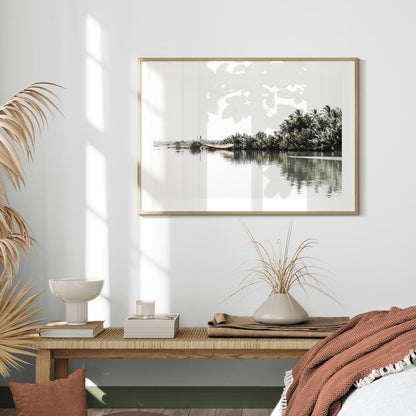 Tranquil Riverbank Landscape with Lush Palm Trees and Serene Waters