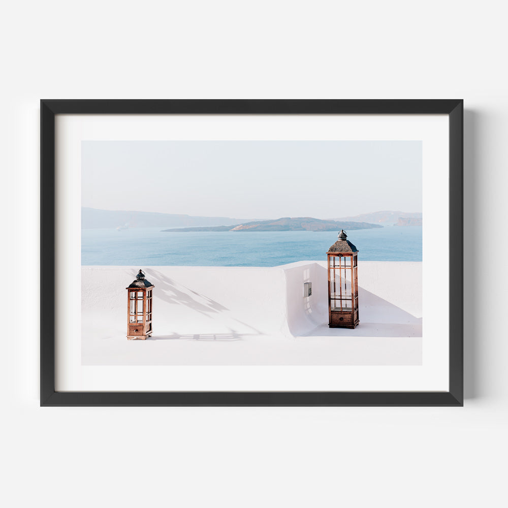 Serene Coastal View with Two Elegant Lanterns Igniting Tranquility