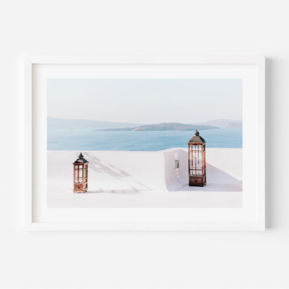 Serene Coastal View with Two Elegant Lanterns Igniting Tranquility