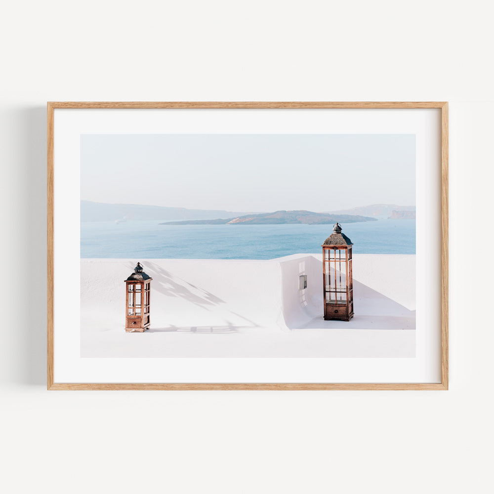 Serene Coastal View with Two Elegant Lanterns Igniting Tranquility