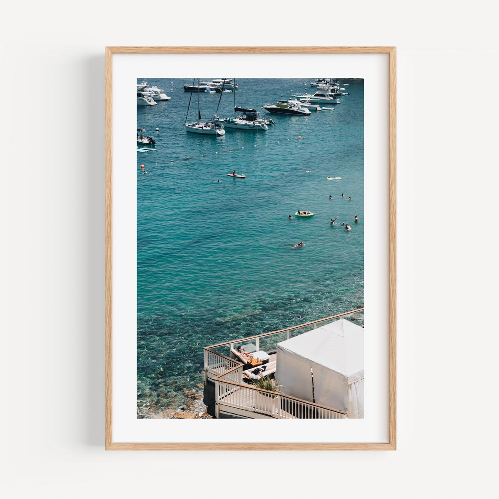 Serene Catalina Beach Scene with Bathers and Moored Boats
