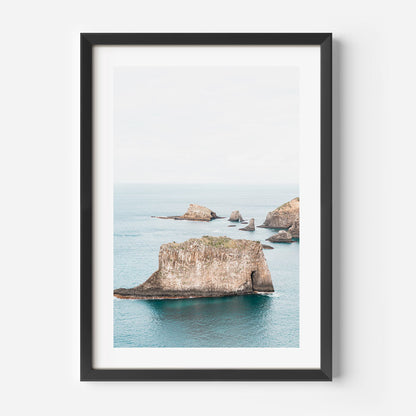 Serene Coastal Landscape with Majestic Rock Formations and Tranquil Waters
