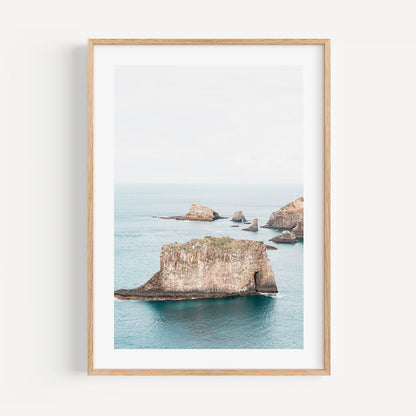 Serene Coastal Landscape with Majestic Rock Formations and Tranquil Waters