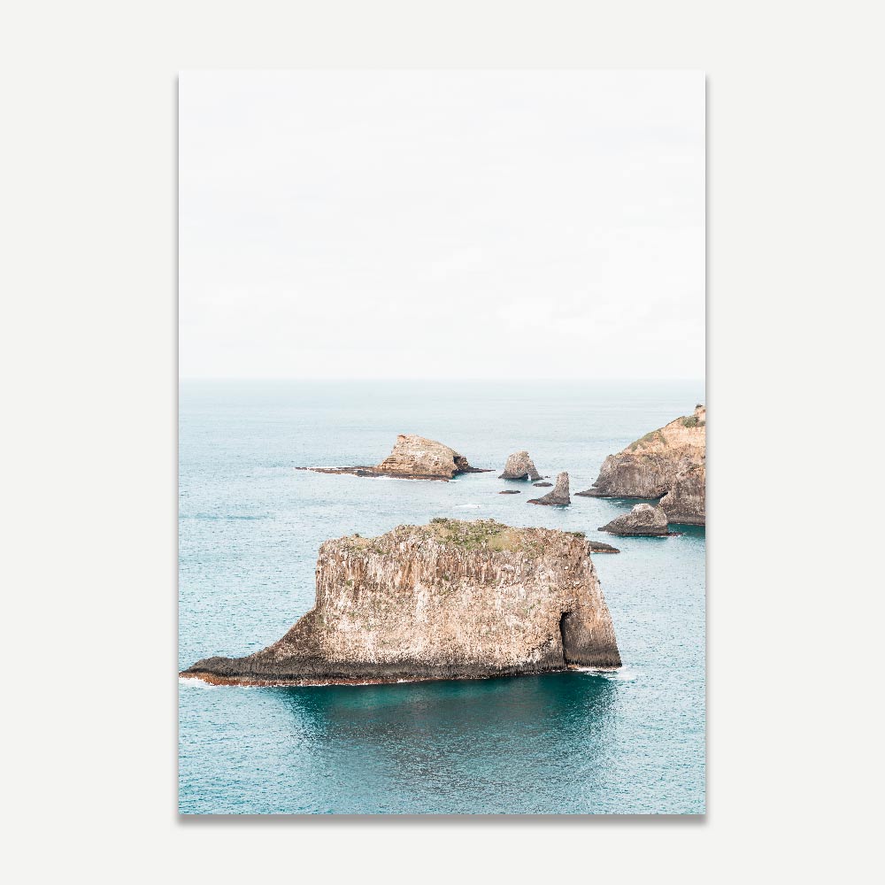 Serene Coastal Landscape with Majestic Rock Formations and Tranquil Waters
